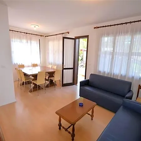 Отель Wide Row House With Private Fenced Garden For 9 Guests In Lignano Pineta Линьяно-Саббьядоро